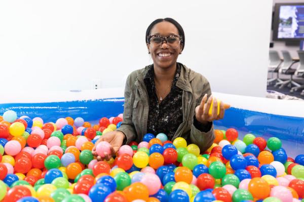Female in a ball pit. 